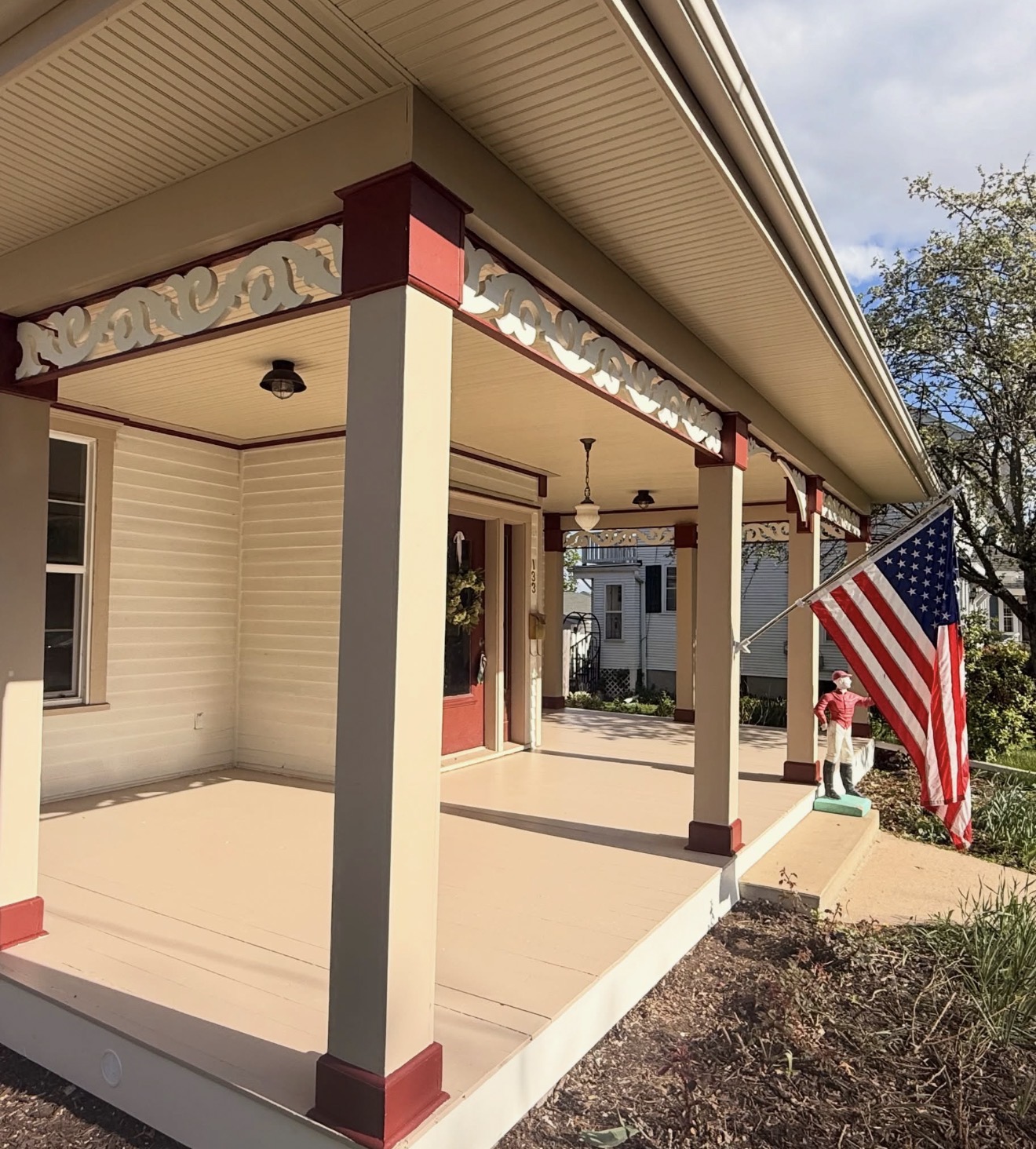 Front porch painting with red and cream trim