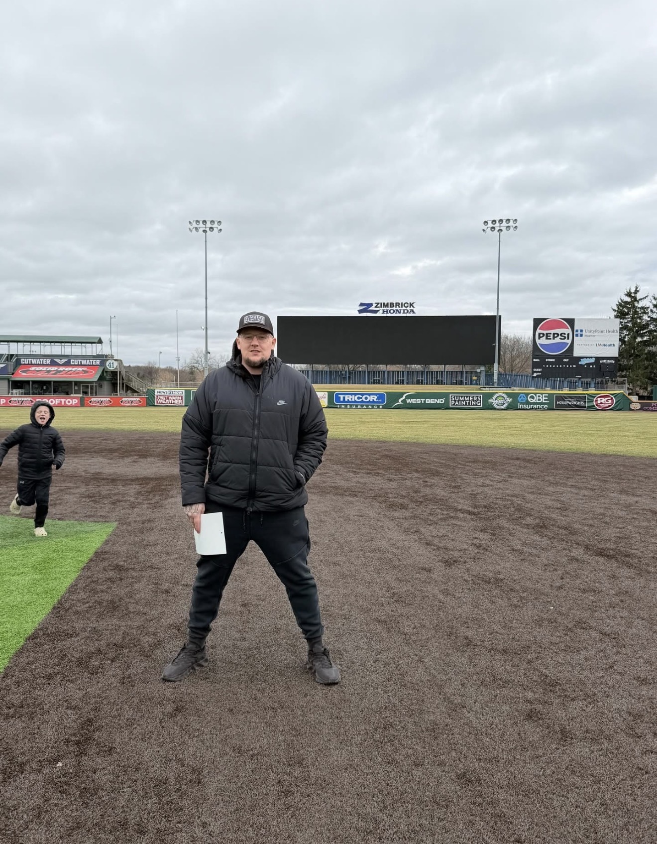 Scott Summers on field at Summers Painting sponsored stadium
