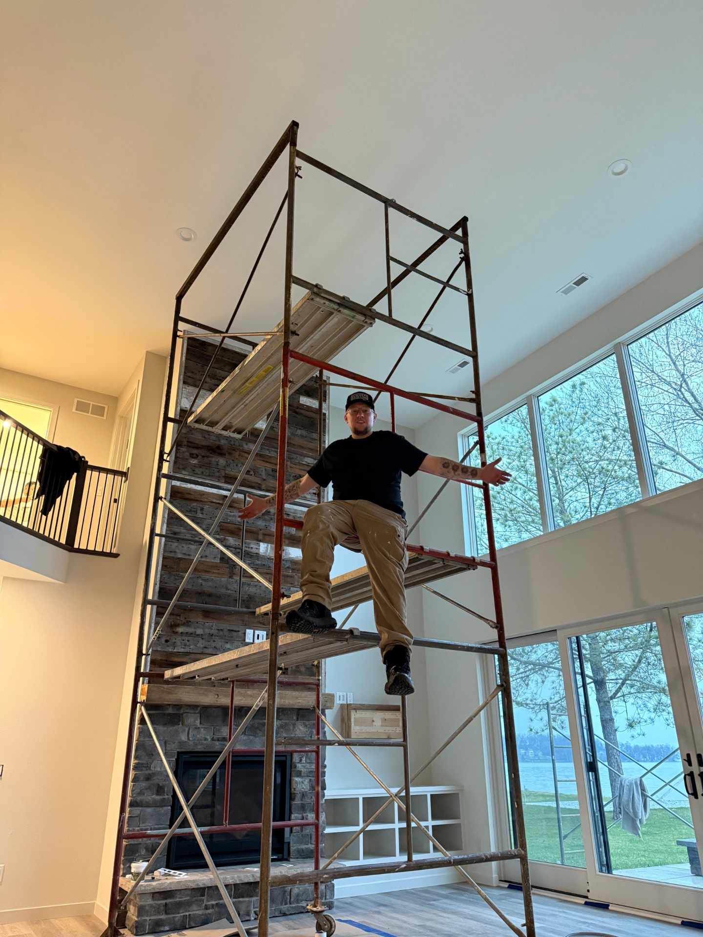 Scott on scaffolding inside a home, Scott Summers, Owner at Summers Painting