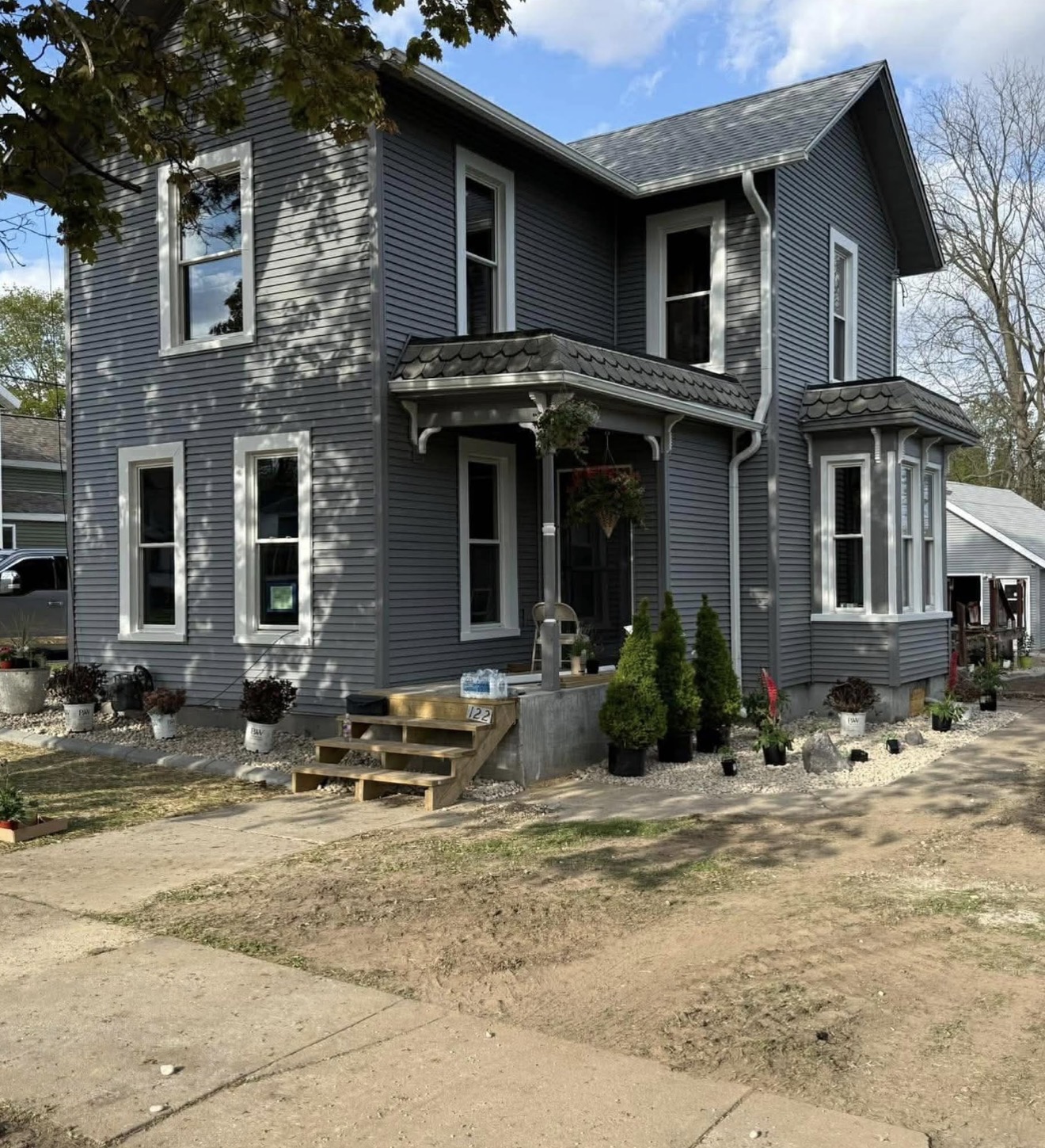 Two story residential exterior repaint in gray