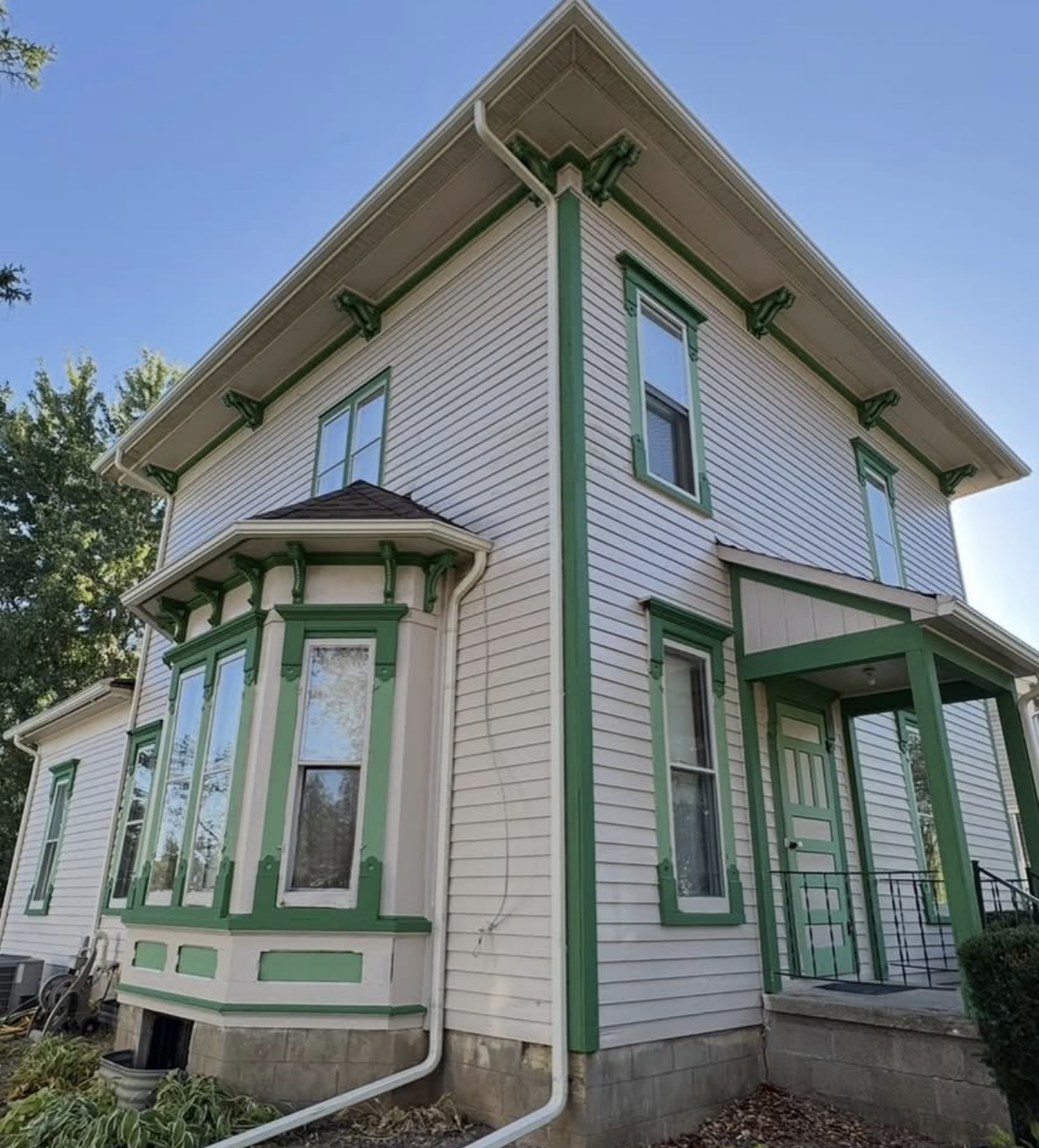 Historic home exterior with green trim accents