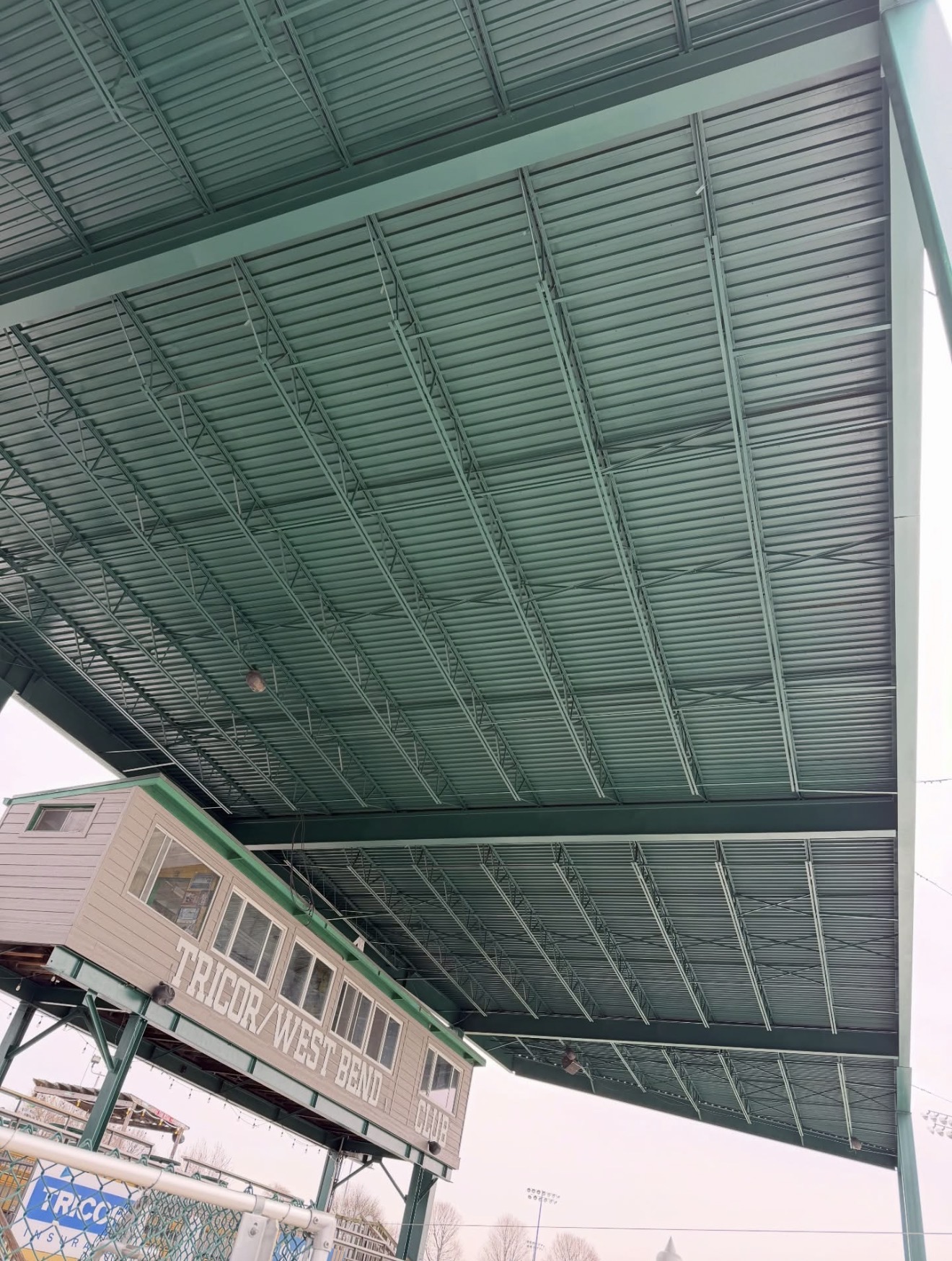 Stadium grandstand roof after repaint in team green