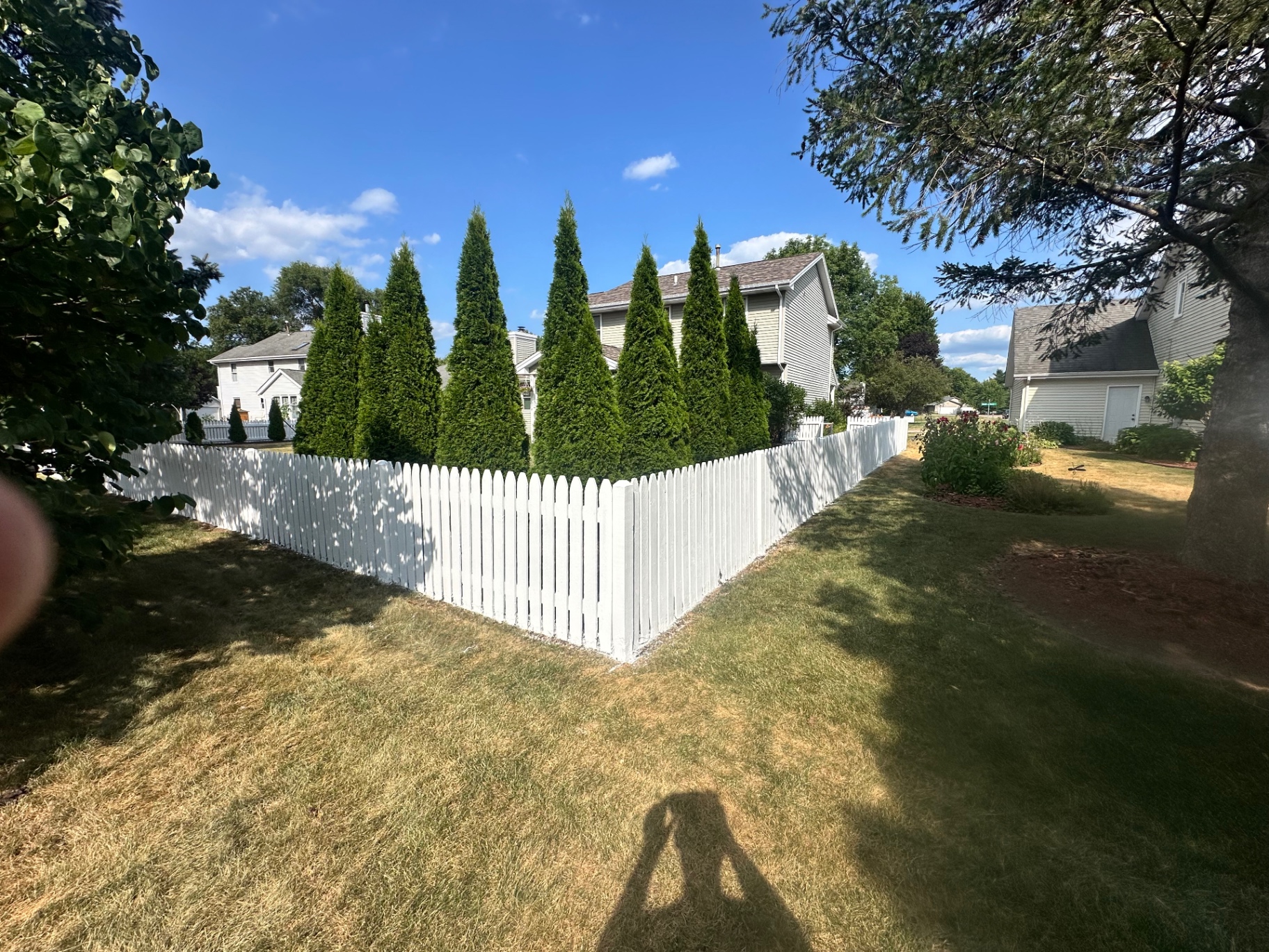 Freshly painted crisp white picket fence exterior in Rockton, Illinois