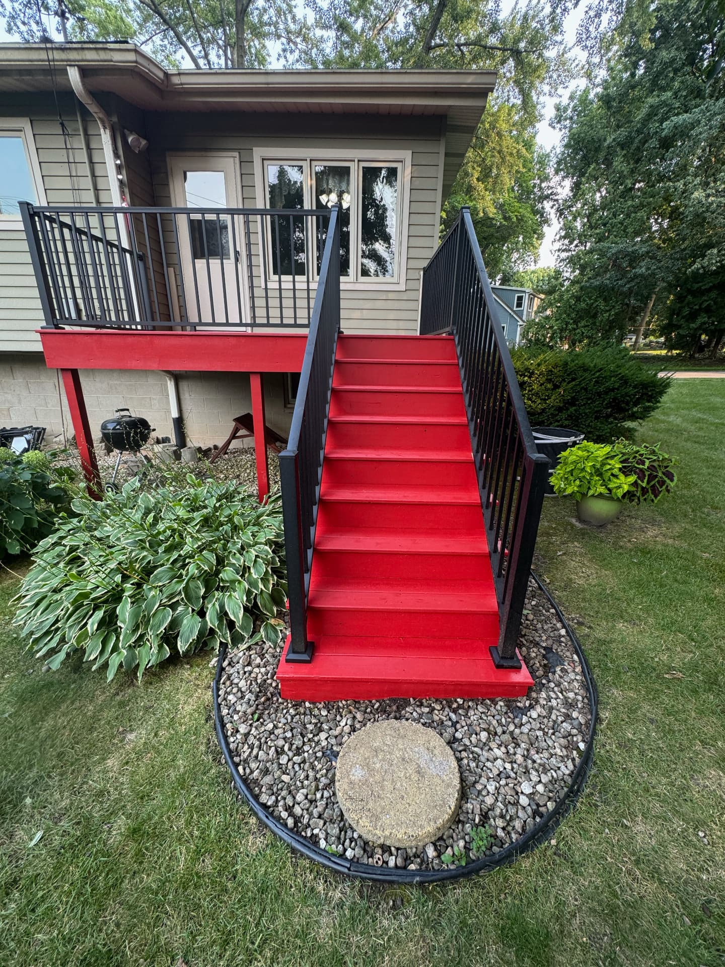Freshly stained red Bolero deck and stairs in Madison, Wisconsin