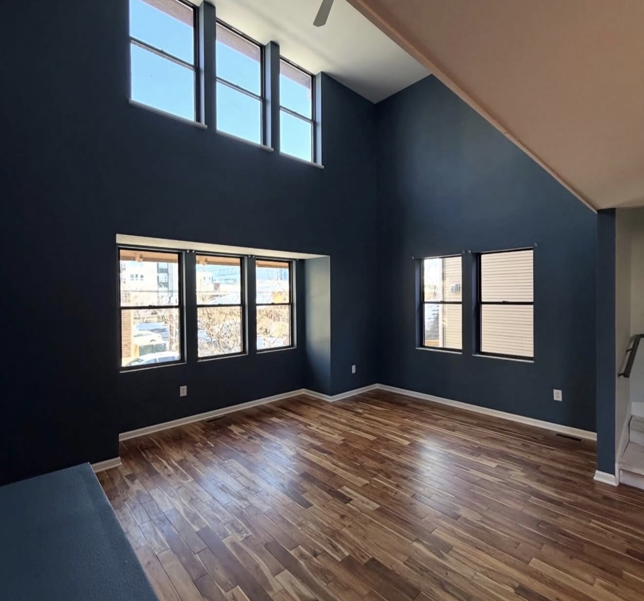 Residential vaulted living room accent wall painting